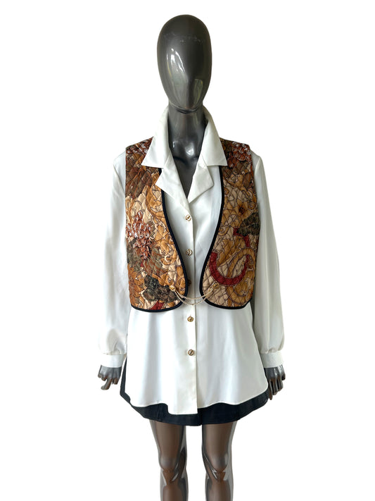Cream tunic blouse and quilted waistcoat